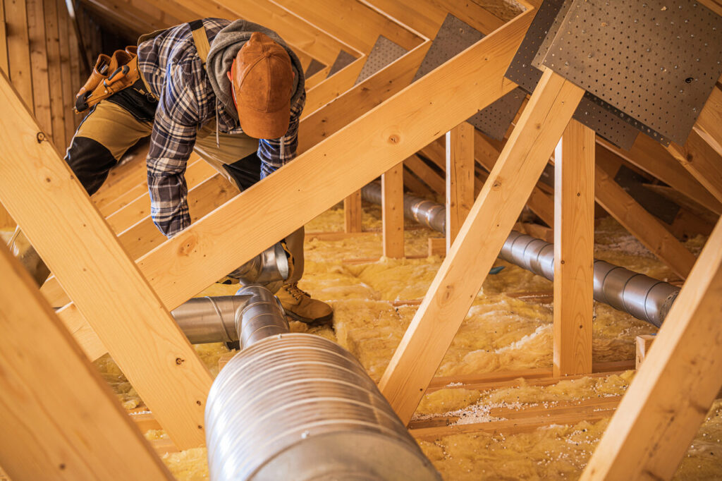 rsz hvac worker installing air ducts 2023 11 27 05 17 48 utc